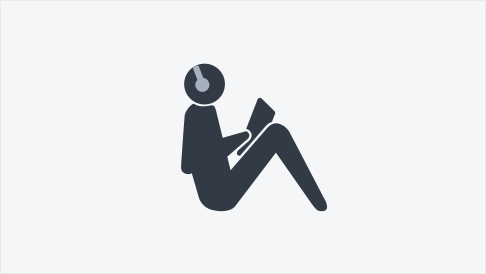 Simple graphic illustration of a person sitting and reading. The person has headphones on.